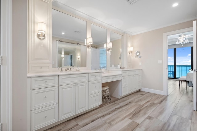 9900 S Ocean Dr Unit 1601, Jensen Beach, FL 34957 - bathroom featuring ensuite bathroom, visible vents, baseboards, vanity, and ornamental molding