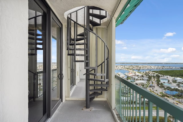 9900 S Ocean Dr Unit 1601, Jensen Beach, FL 34957 - balcony featuring stairs and a water view