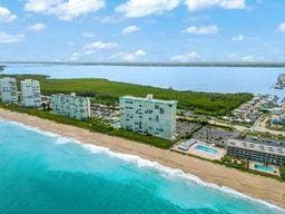 9900 S Ocean Dr Unit 1601, Jensen Beach, FL 34957 - birds eye view of property featuring a beach view and a water view