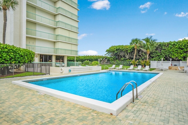 9900 S Ocean Dr Unit 1601, Jensen Beach, FL 34957 - community pool featuring fence and a patio