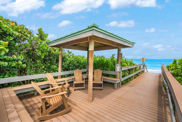 9900 S Ocean Dr Unit 1601, Jensen Beach, FL 34957 - wooden deck with a gazebo, a beach view, and a water view