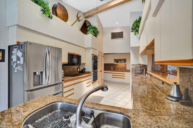 13179 Camero Way, Palm Beach Gardens, FL 33418 - kitchen featuring black appliances, a sink, high vaulted ceiling, decorative backsplash, and beam ceiling