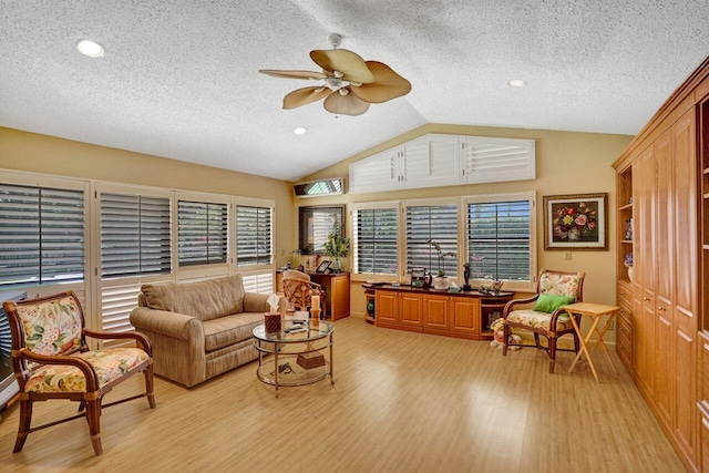 13179 Camero Way, Palm Beach Gardens, FL 33418 - living area with light wood-type flooring, vaulted ceiling, ceiling fan, a textured ceiling, and recessed lighting
