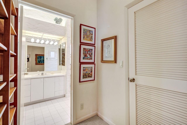 13179 Camero Way, Palm Beach Gardens, FL 33418 - bathroom with vanity, tile patterned flooring, and baseboards