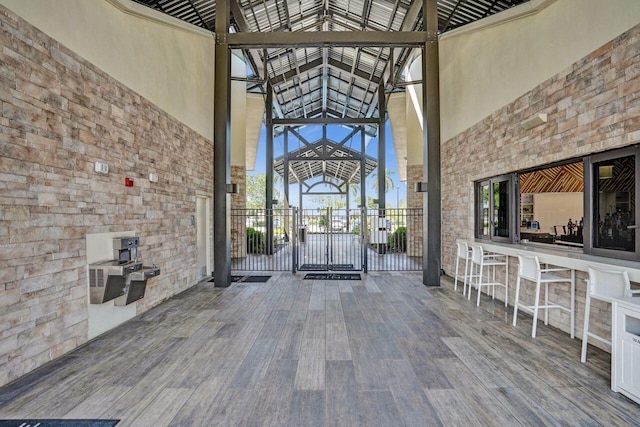 13179 Camero Way, Palm Beach Gardens, FL 33418 - property entrance featuring stone siding and an outdoor bar
