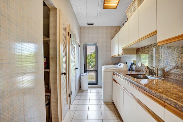 13179 Camero Way, Palm Beach Gardens, FL 33418 - laundry room featuring cabinet space, attic access, light tile patterned floors, and washing machine and dryer