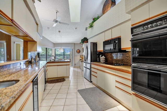 13179 Camero Way, Palm Beach Gardens, FL 33418 - kitchen featuring black appliances, a textured ceiling, a peninsula, backsplash, and ceiling fan
