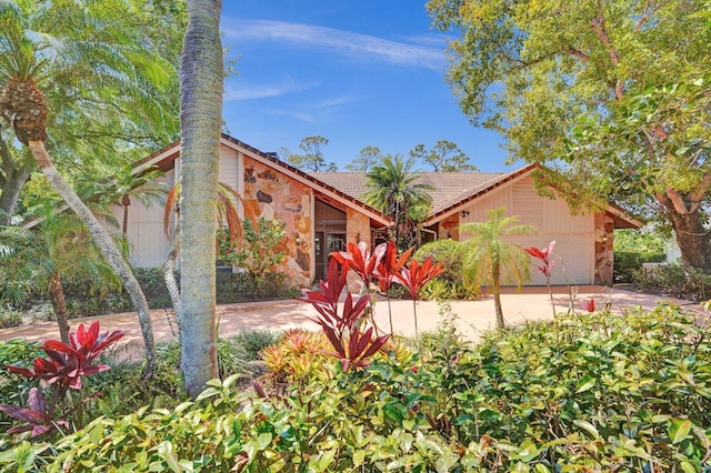 13179 Camero Way, Palm Beach Gardens, FL 33418 - view of front facade featuring an attached garage, a tile roof, and driveway