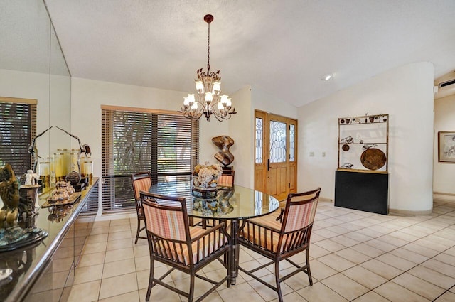 13179 Camero Way, Palm Beach Gardens, FL 33418 - dining area with lofted ceiling, a chandelier, and light tile patterned flooring