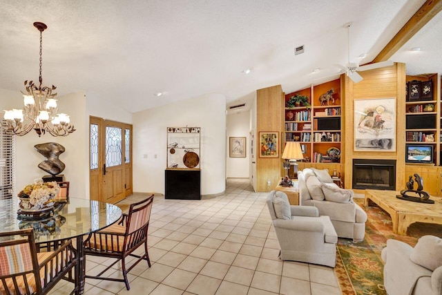 13179 Camero Way, Palm Beach Gardens, FL 33418 - living room featuring lofted ceiling, built in features, a chandelier, light tile patterned flooring, and ceiling fan