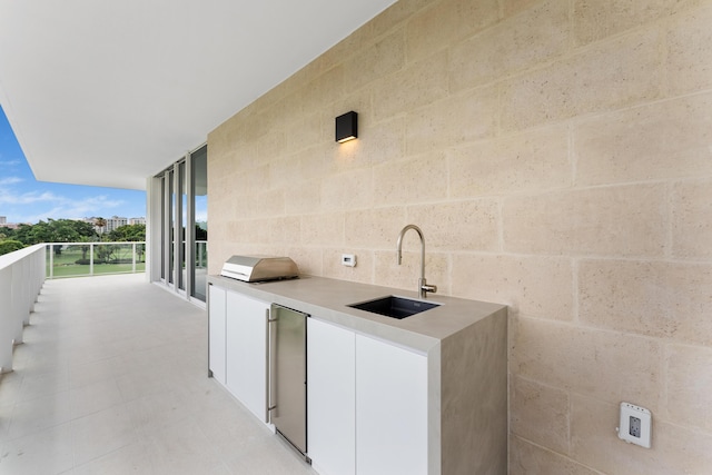 210 SE Mizner Blvd Unit 301, Boca Raton, FL 33432 - view of patio featuring a sink and a balcony