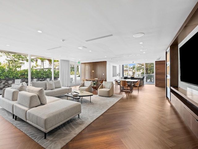 210 SE Mizner Blvd Unit 301, Boca Raton, FL 33432 - living room featuring a wall of windows and recessed lighting