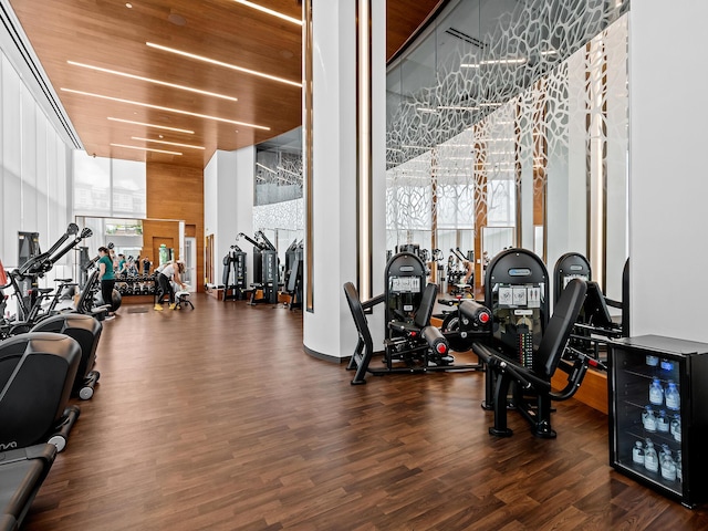 210 SE Mizner Blvd Unit 301, Boca Raton, FL 33432 - exercise room featuring wood finished floors, beverage cooler, and expansive windows