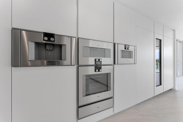 210 SE Mizner Blvd Unit 301, Boca Raton, FL 33432 - kitchen view of white cabinets