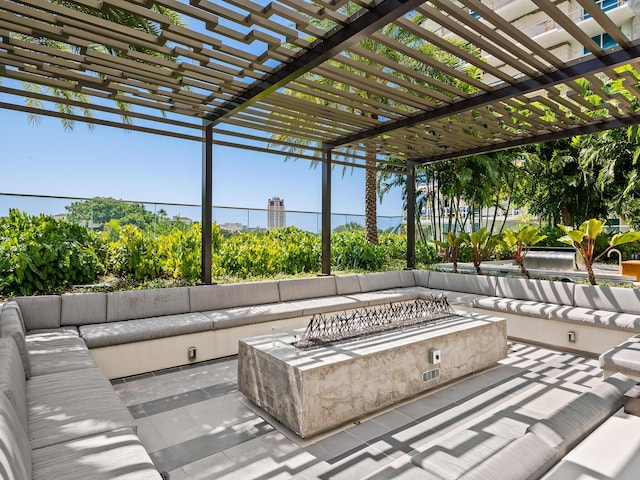 210 SE Mizner Blvd Unit 301, Boca Raton, FL 33432 - view of patio / terrace with an outdoor living space with a fire pit and a pergola
