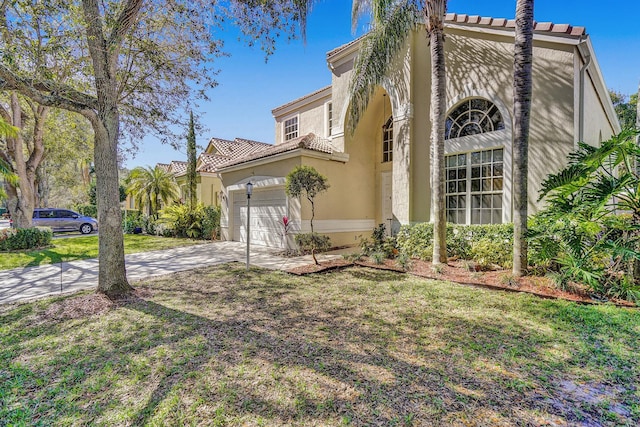 view of property exterior with driveway, a tile roof, an attached garage, stucco siding, and a yard