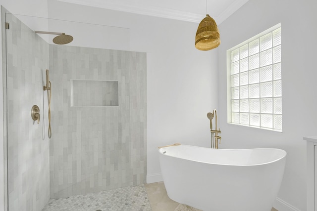 full bathroom featuring crown molding, a freestanding tub, tiled shower, and a healthy amount of sunlight