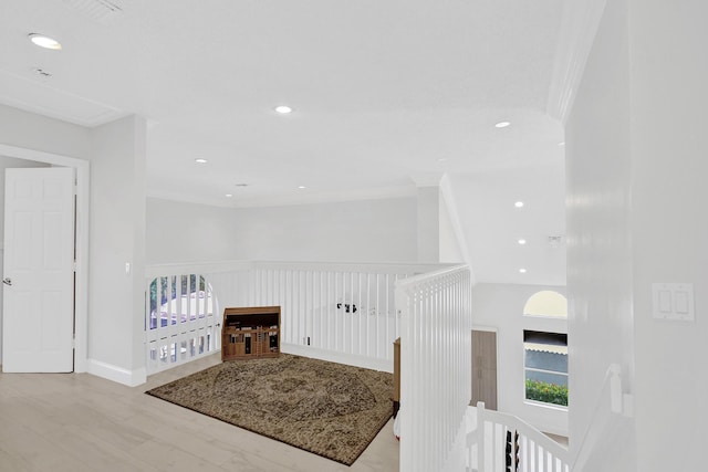 hall with an upstairs landing, recessed lighting, and ornamental molding