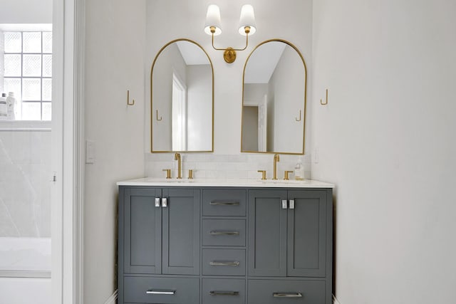full bath with double vanity and a sink