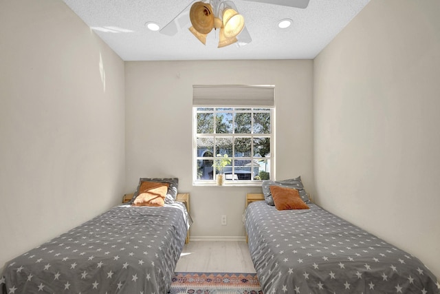 bedroom featuring ceiling fan, recessed lighting, and baseboards