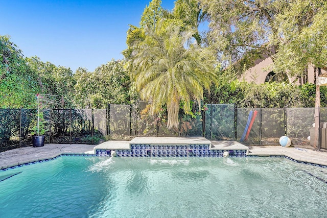 view of swimming pool with fence and a fenced in pool