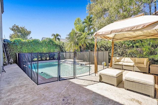 view of swimming pool with a patio area, an outdoor hangout area, a jacuzzi, and a fenced backyard