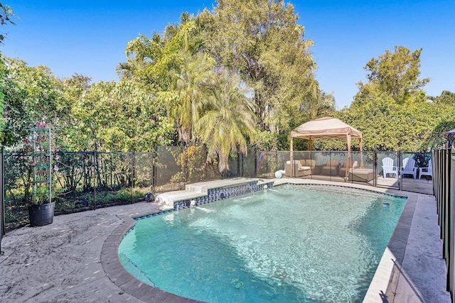 view of swimming pool featuring a fenced in pool, a gazebo, and a fenced backyard