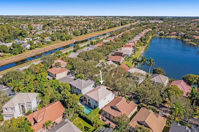 birds eye view of property with a residential view and a water view