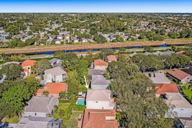 birds eye view of property featuring a water view and a residential view