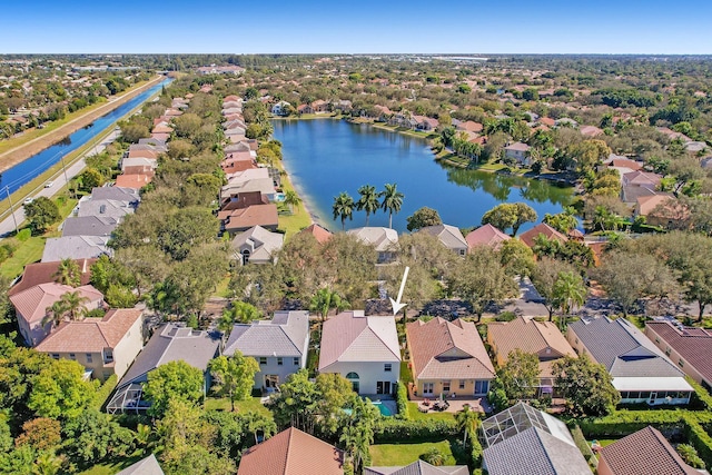 bird's eye view featuring a water view and a residential view