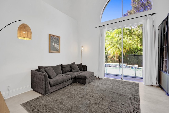 living room featuring a towering ceiling