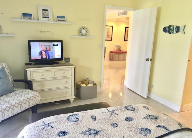 1705 Presidential Way N Unit B101, West Palm Beach, FL 33401 - bedroom with baseboards and light tile patterned floors