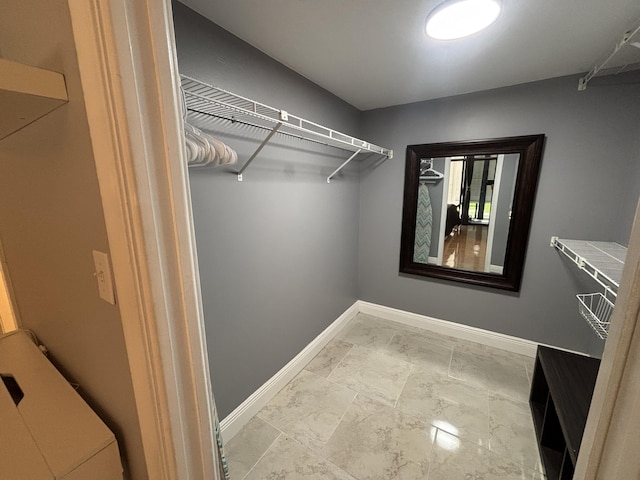 1705 Presidential Way N Unit B101, West Palm Beach, FL 33401 - walk in closet with marble finish flooring