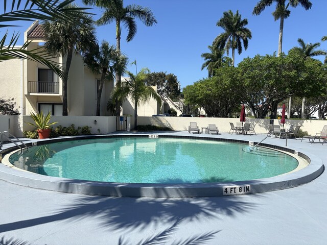 1705 Presidential Way N Unit B101, West Palm Beach, FL 33401 - community pool with a patio and fence