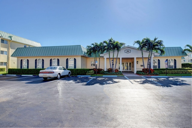 view of property with uncovered parking