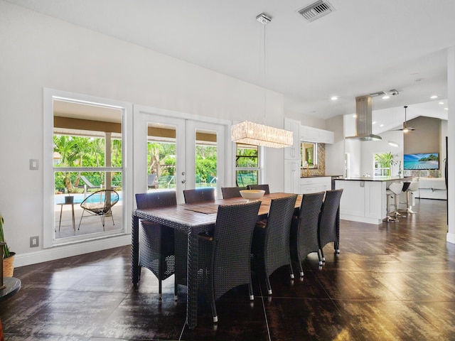 17411 N 40th Run, Loxahatchee, FL 33470 - dining space with french doors, baseboards, and vaulted ceiling