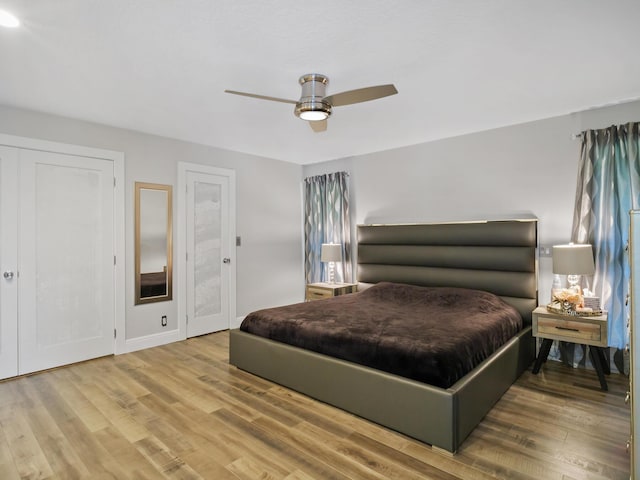 17411 N 40th Run, Loxahatchee, FL 33470 - bedroom with wood finished floors, a ceiling fan, and baseboards
