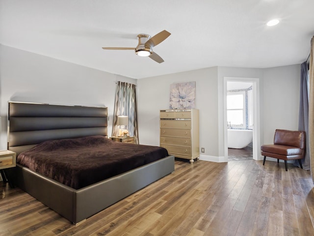 17411 N 40th Run, Loxahatchee, FL 33470 - bedroom with baseboards, wood finished floors, recessed lighting, a ceiling fan, and ensuite bath