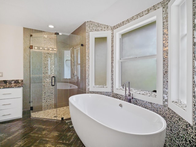 17411 N 40th Run, Loxahatchee, FL 33470 - full bathroom with a shower stall, a freestanding tub, tile walls, and recessed lighting