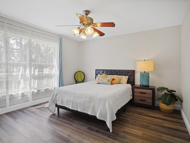 17411 N 40th Run, Loxahatchee, FL 33470 - bedroom with wood finished floors, baseboards, and a ceiling fan