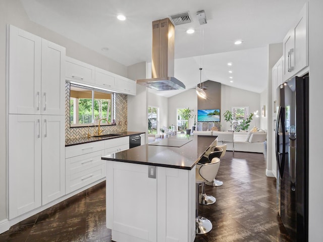 17411 N 40th Run, Loxahatchee, FL 33470 - kitchen with black appliances, island exhaust hood, dark countertops, a sink, and open floor plan