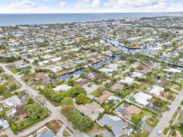 birds eye view of property featuring a water view and a residential view