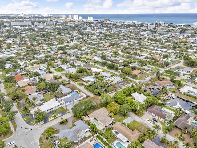 birds eye view of property featuring a water view and a residential view
