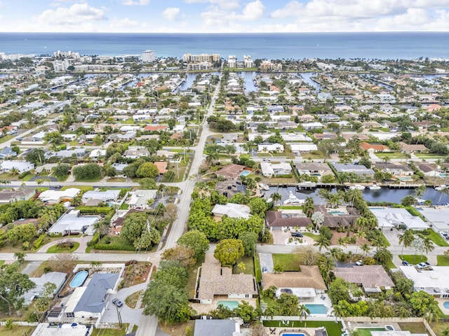 birds eye view of property with a water view and a residential view