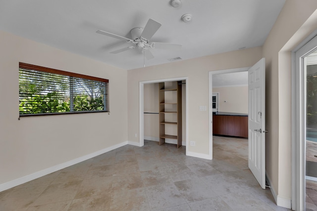 unfurnished bedroom with ceiling fan, baseboards, a closet, and visible vents