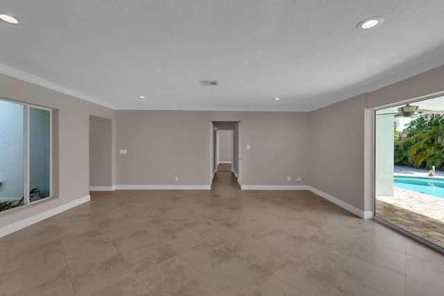 empty room featuring a textured ceiling, visible vents, ornamental molding, and recessed lighting