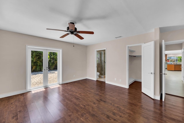 unfurnished bedroom featuring french doors, wood finished floors, visible vents, baseboards, and access to exterior