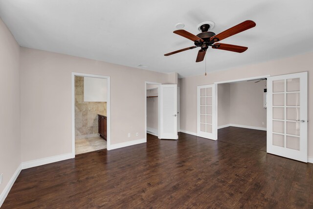 spare room with french doors, wood finished floors, visible vents, baseboards, and ceiling fan