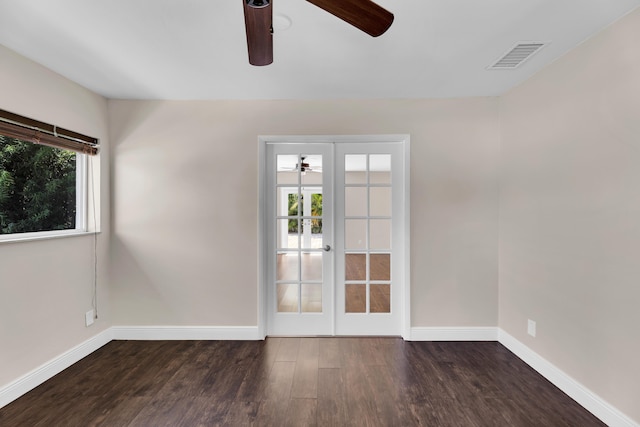 unfurnished room with a ceiling fan, baseboards, visible vents, and wood finished floors