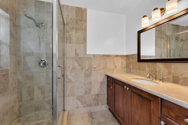 bathroom with vanity and a shower stall